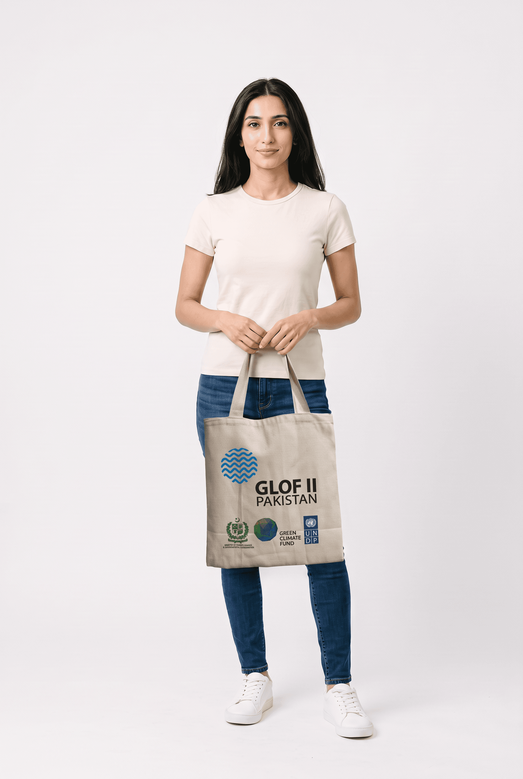 Female model carrying tote bag, studio shot