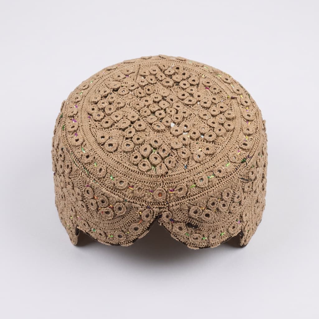 Beige crochet prayer cap with openwork floral texture